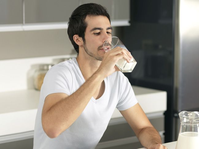 Adult drinking milk