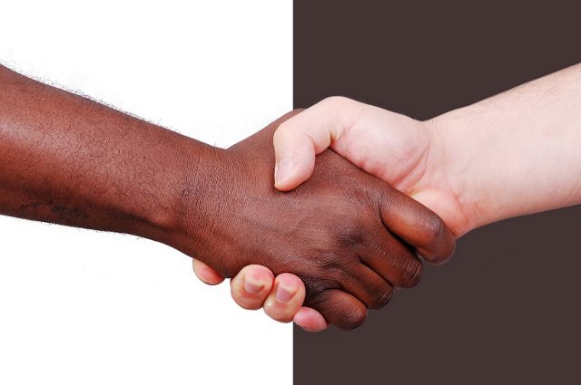Interracial hands shaking